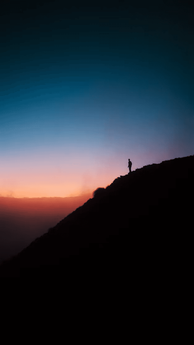 A misty mountain sunset shared as a TalksTry status update
