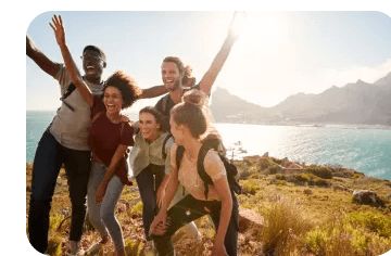A group of friends celebrating together on a hike